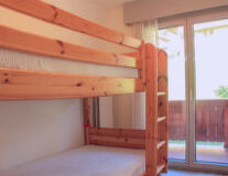 a bed with a wooden door